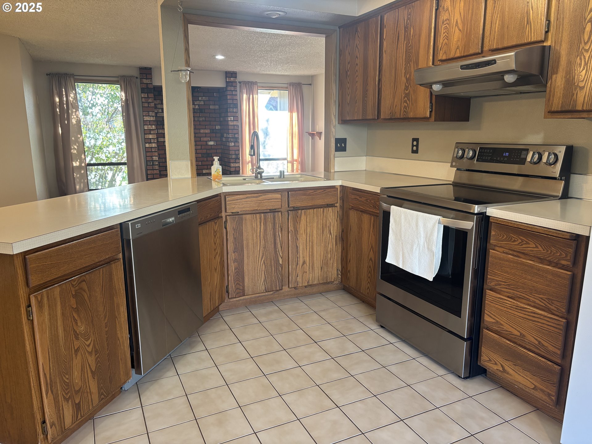 1101 Southwest 37th Street Pendleton, OR 97801 - Photo 7 of 22 a kitchen with a sink stove and cabinets
