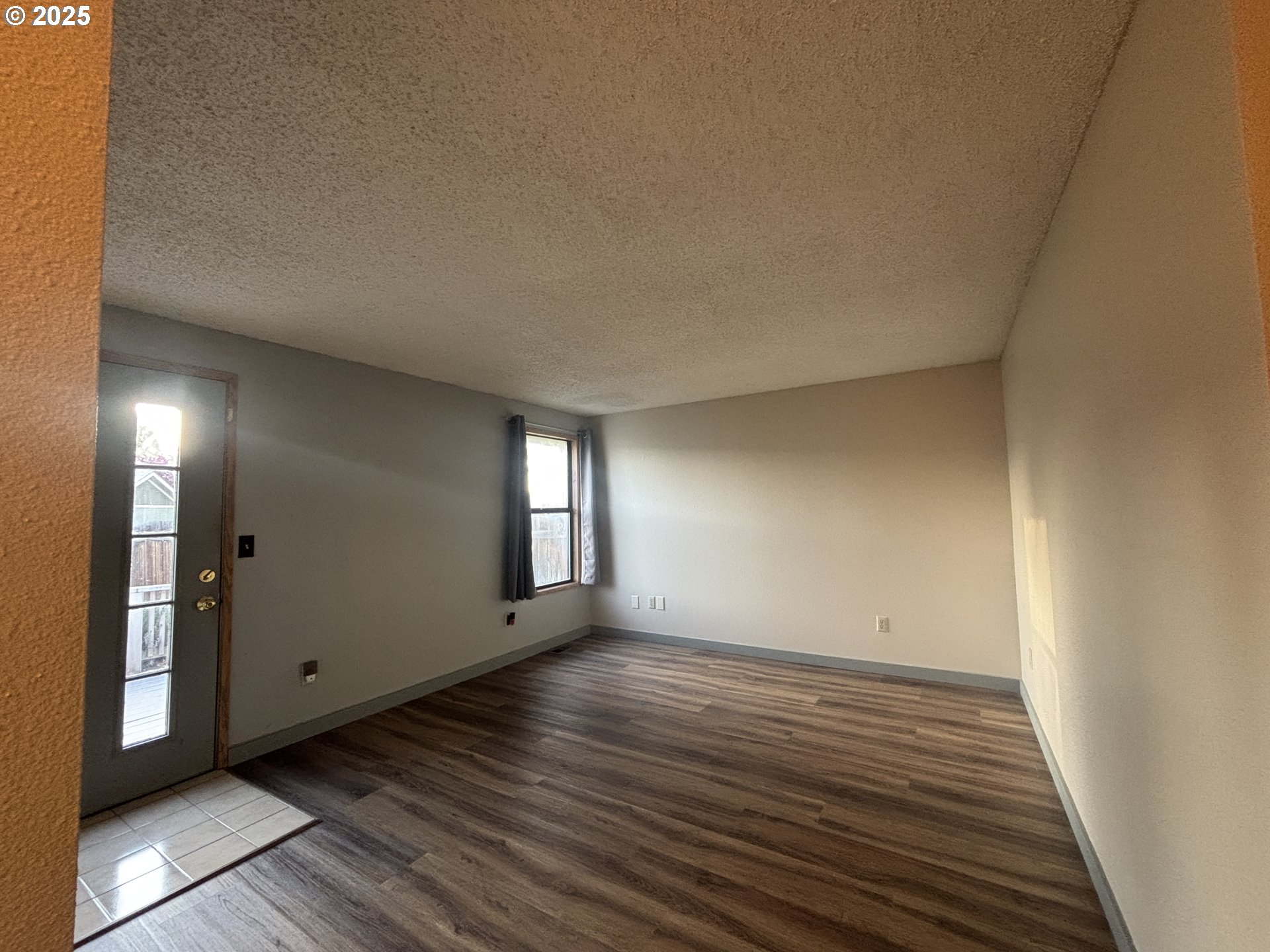 1101 Southwest 37th Street Pendleton, OR 97801 - Photo 8 of 22 a view of an empty room with window and wooden floor