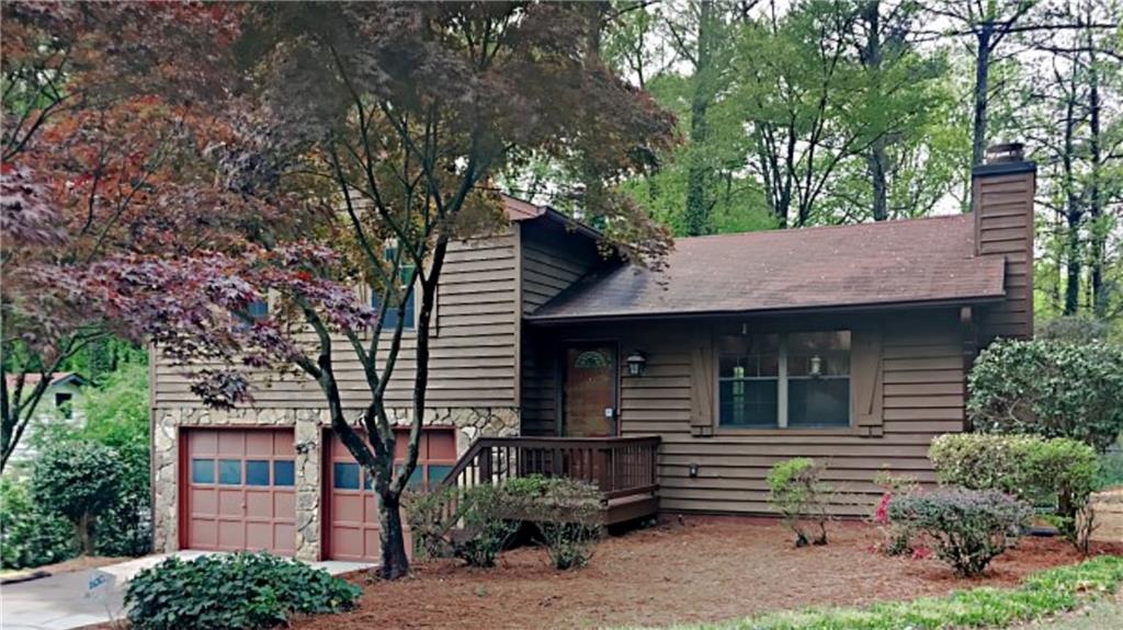 798 Sheppard Road Stone Mountain, GA 30083 - Photo 1 of 1 a view of a house with a garden