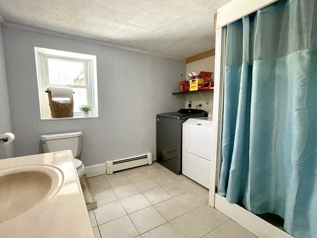 50 Adams Road Townsend, MA 01469 - Photo 23 of 31 a bedroom with a bed and a sink