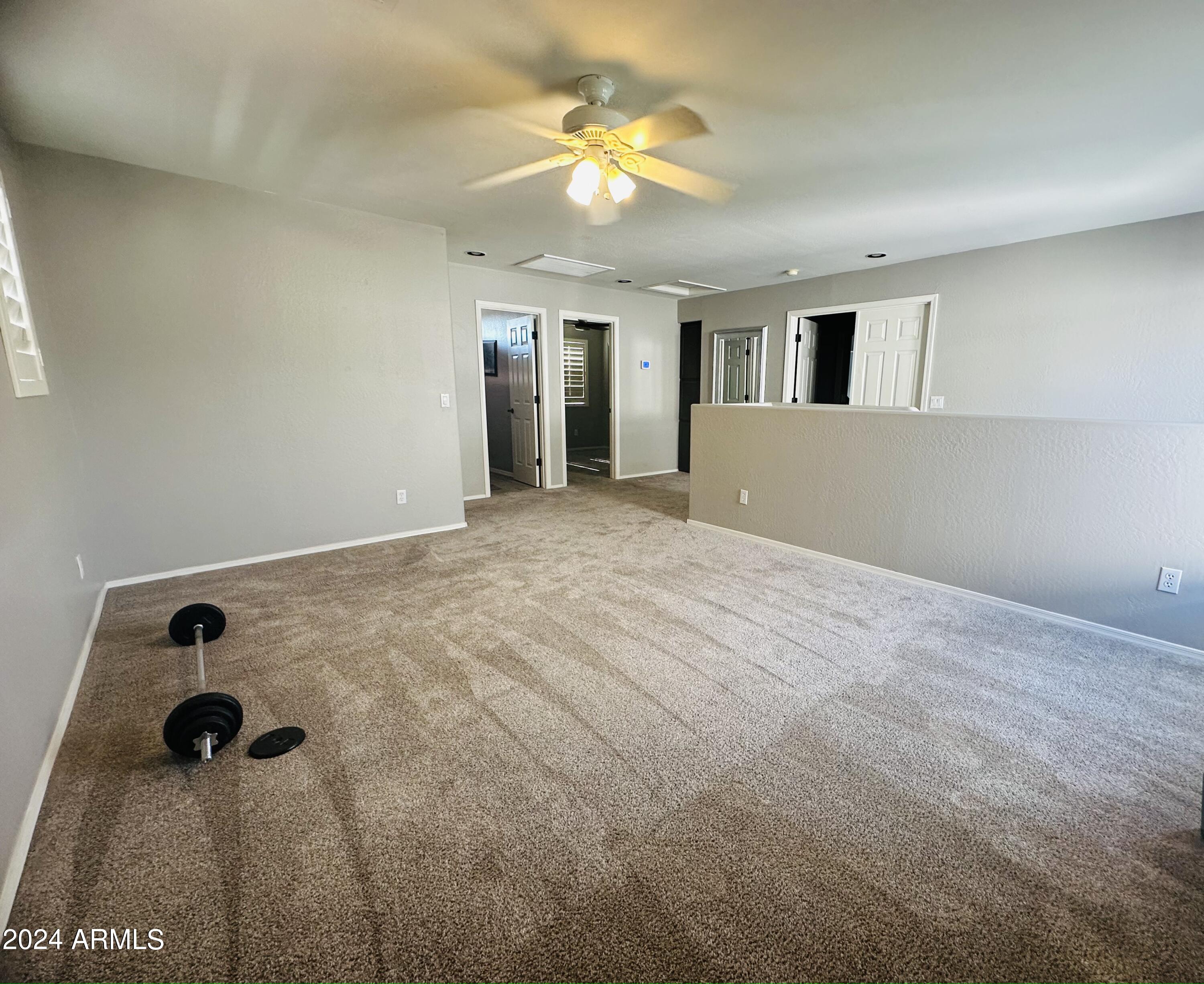 90 West Beechnut Place Chandler, AZ 85248 - Photo 19 of 31 wooden floor in an empty room with a window