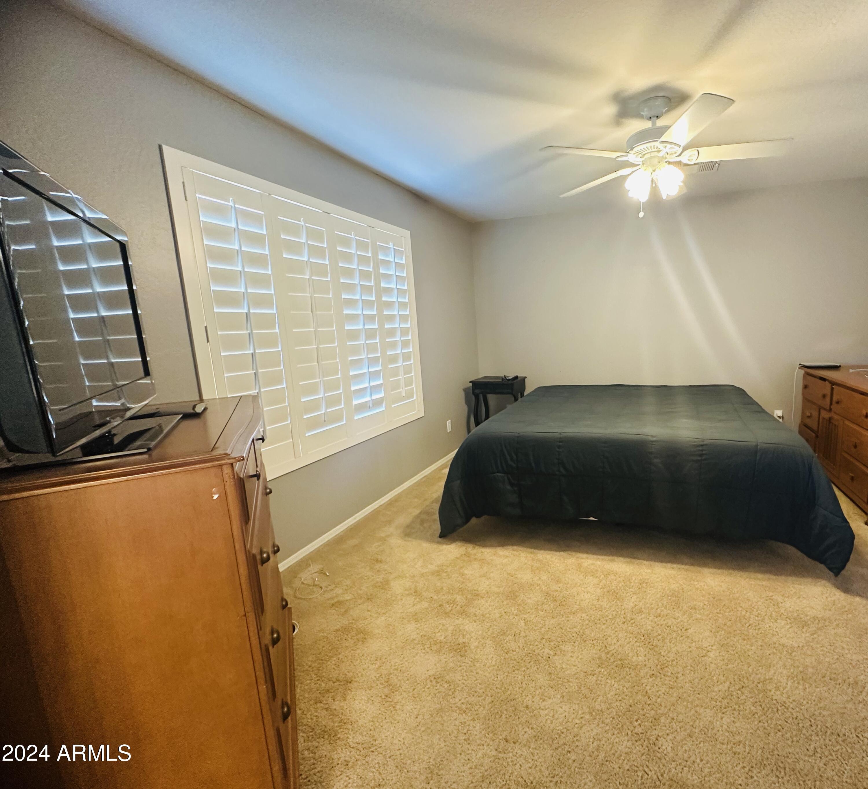 90 West Beechnut Place Chandler, AZ 85248 - Photo 23 of 31 a car parked in a bedroom next to a window