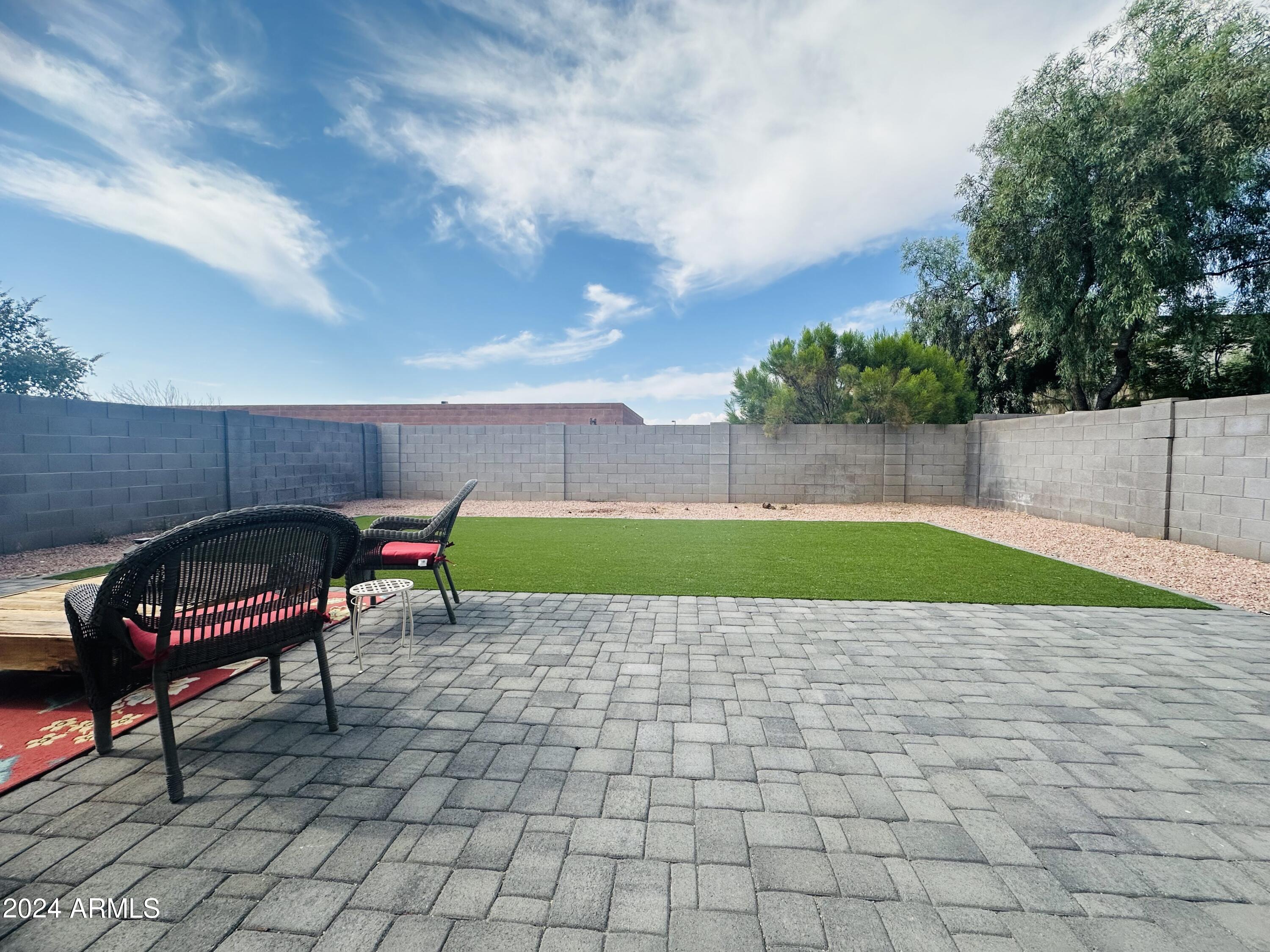 90 West Beechnut Place Chandler, AZ 85248 - Photo 30 of 31 a view of a backyard with sitting area