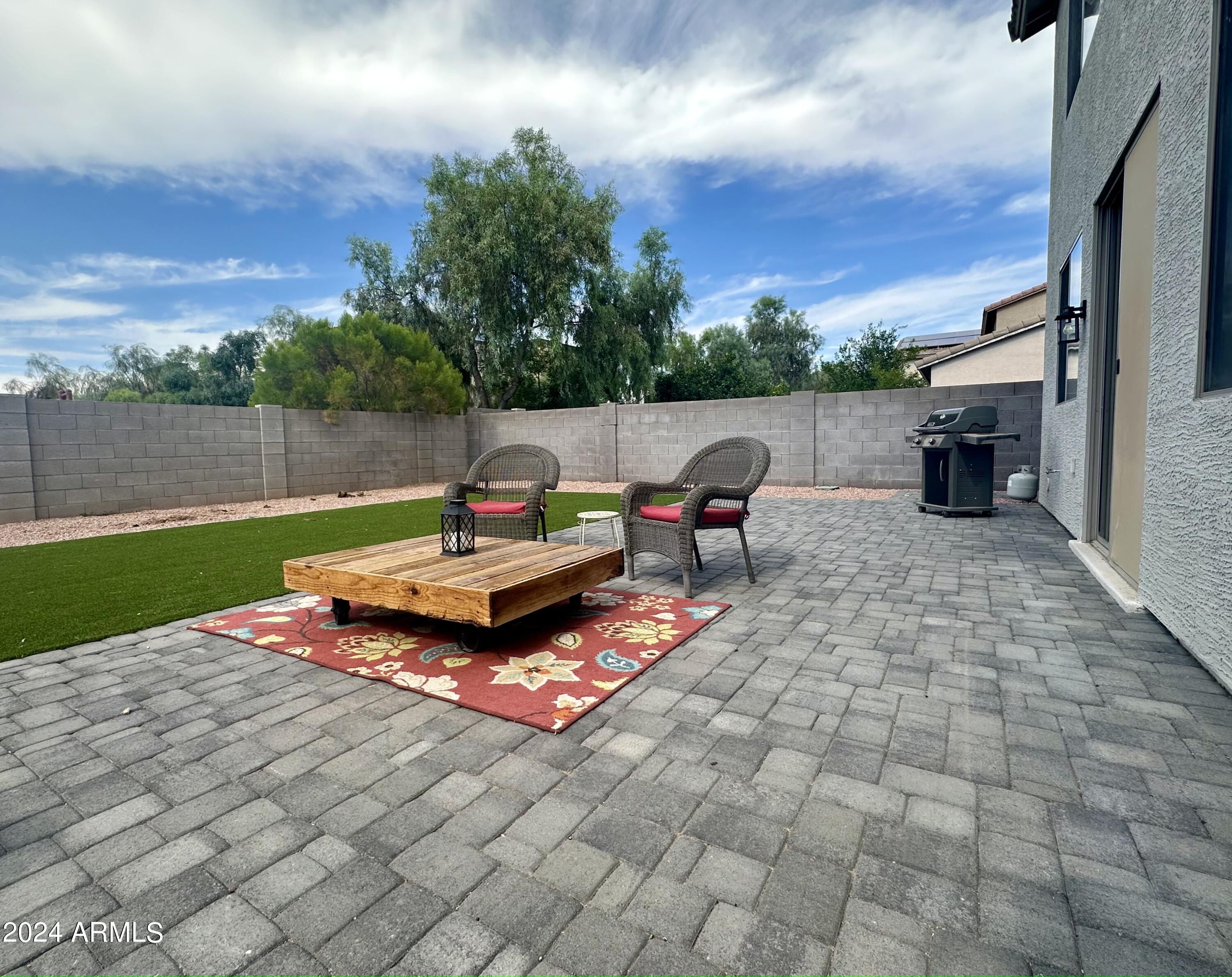 90 West Beechnut Place Chandler, AZ 85248 - Photo 3 of 31 a backyard of a house with table and chairs