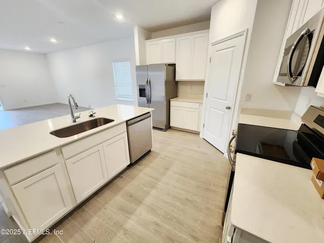 a view of an empty room and a window