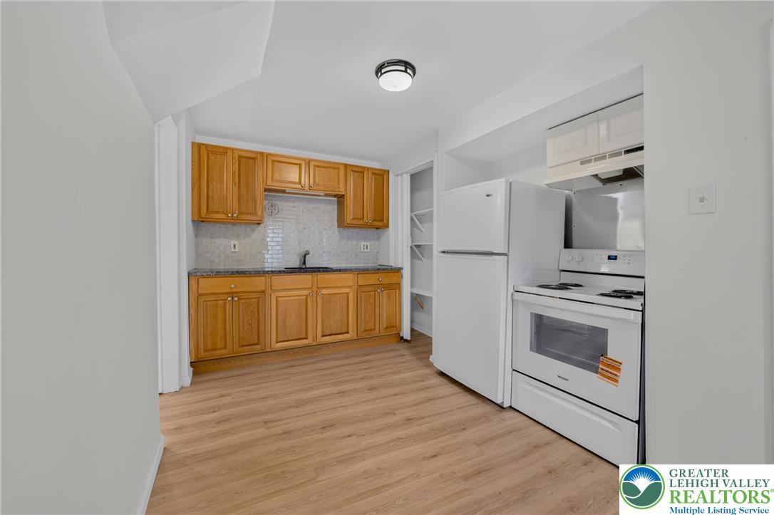 313 Main Street Slatington, PA 18080 - Photo 29 of 73 A well-appointed kitchen features ample cabinetry, stone countertops, and modern appliances.