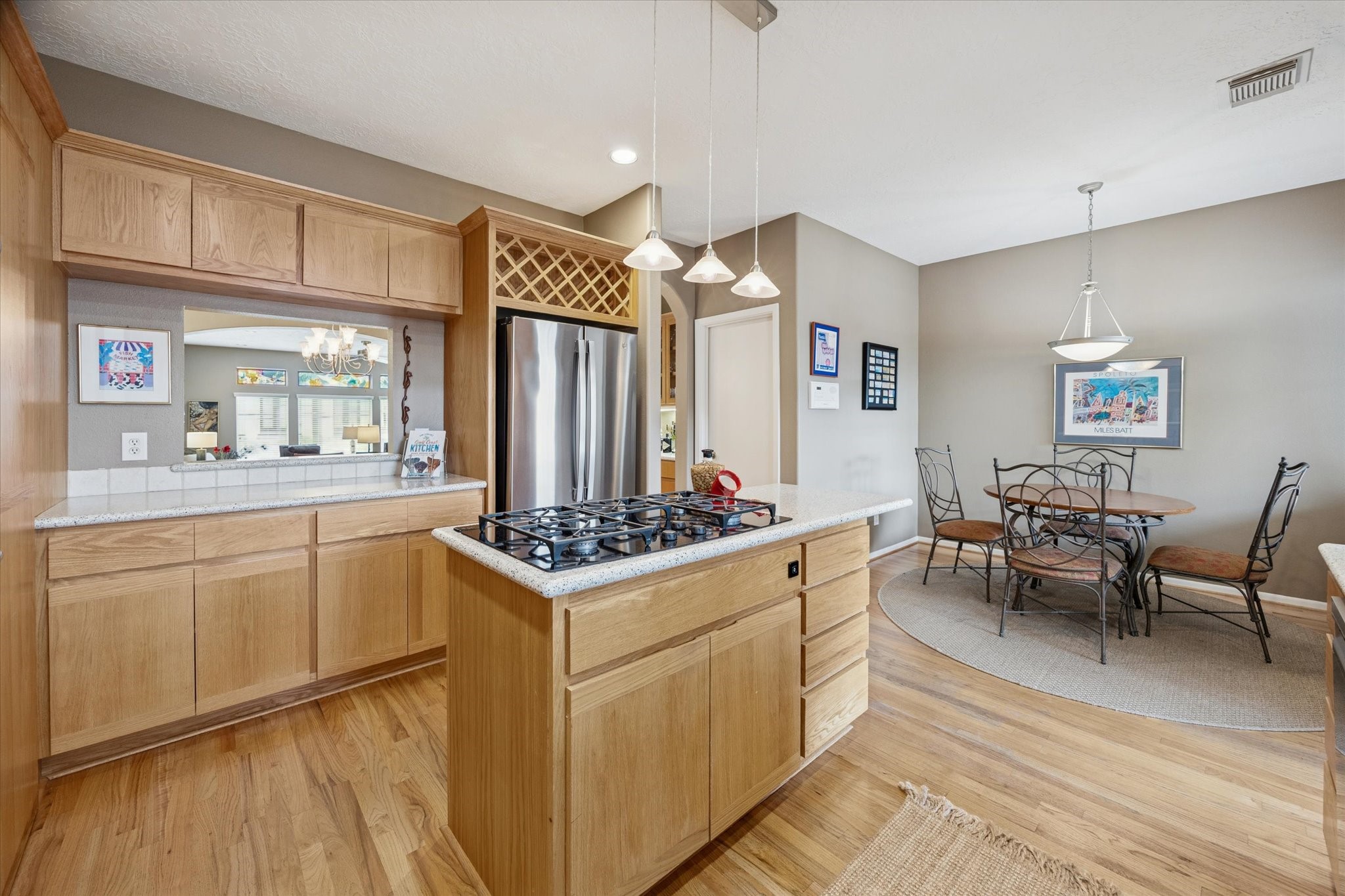 210 Malone Street Houston, TX 77007 - Photo 17 of 34 Another view of the kitchen showing the pass through between the kitchen and dining room.