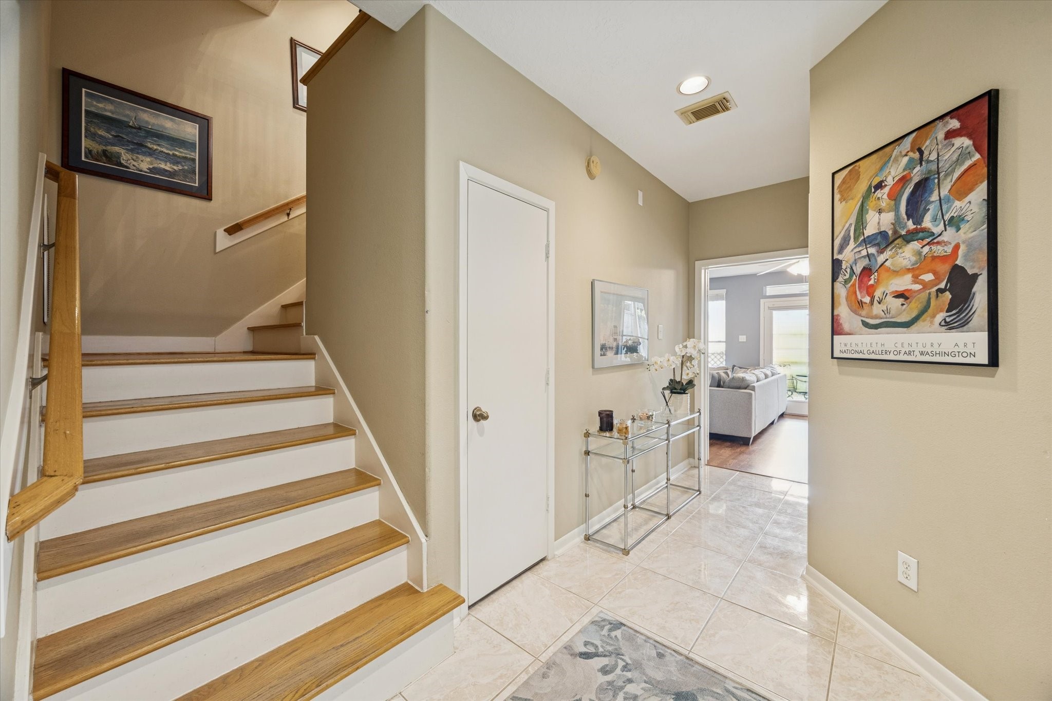 210 Malone Street Houston, TX 77007 - Photo 4 of 34 Entering from the front door, the hallway to the right access a full bathroom and bedroom and/or second living space.