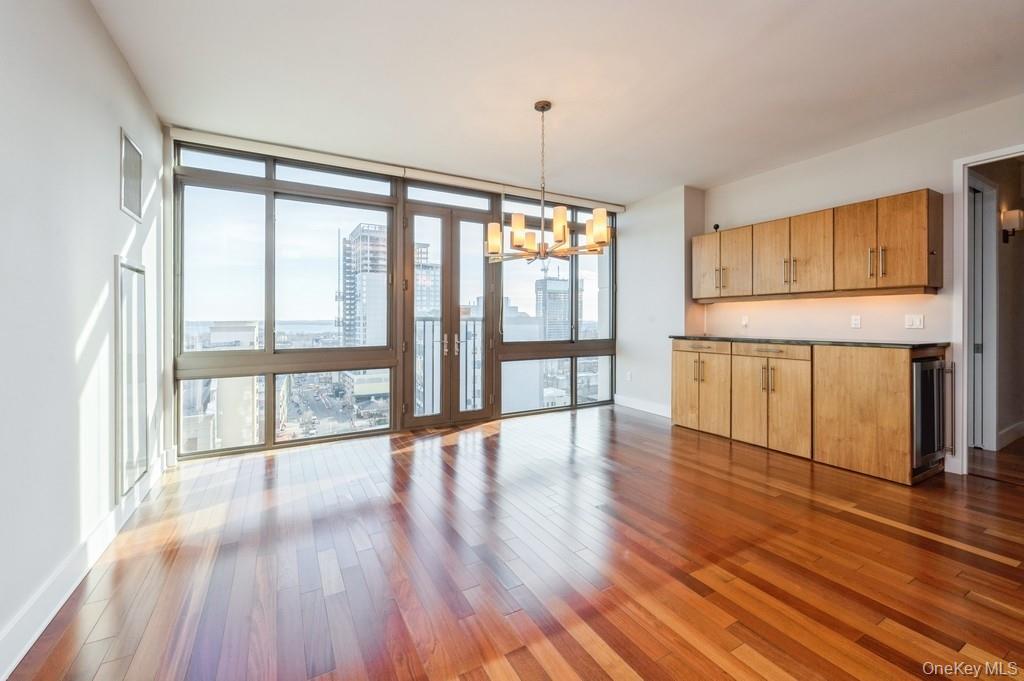 Spacious living room with custom built-ins, great water views.