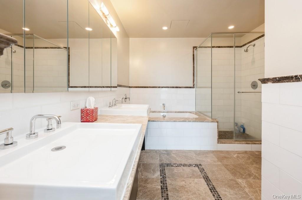 175 Huguenot Street, Unit 1604 New Rochelle, NY 10801 - Photo 11 of 24 Master bedroom's spa bath with double vanities, jet-air tub, separate shower stall, lots of storage space.