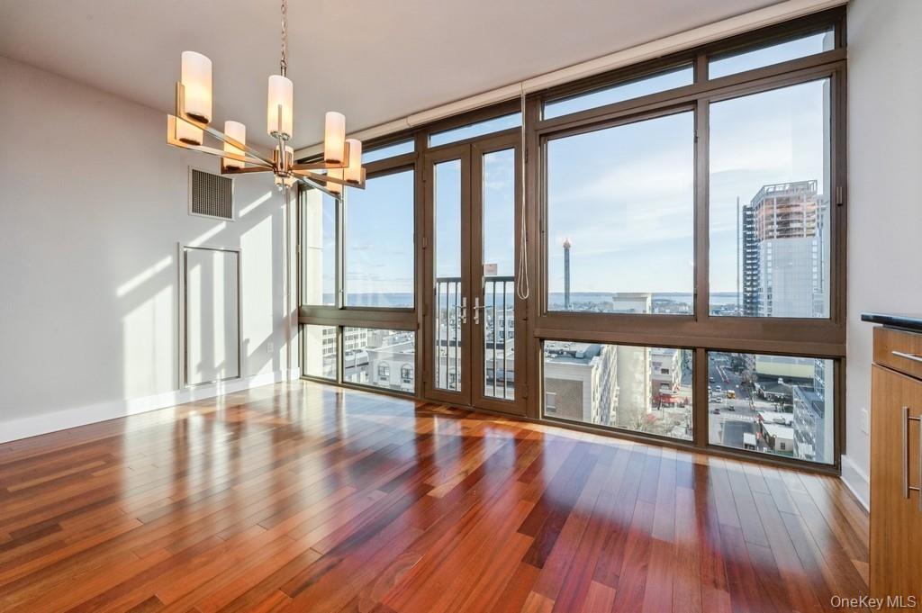 175 Huguenot Street, Unit 1604 New Rochelle, NY 10801 - Photo 6 of 24 Large living room with Juliette doors with great water views.