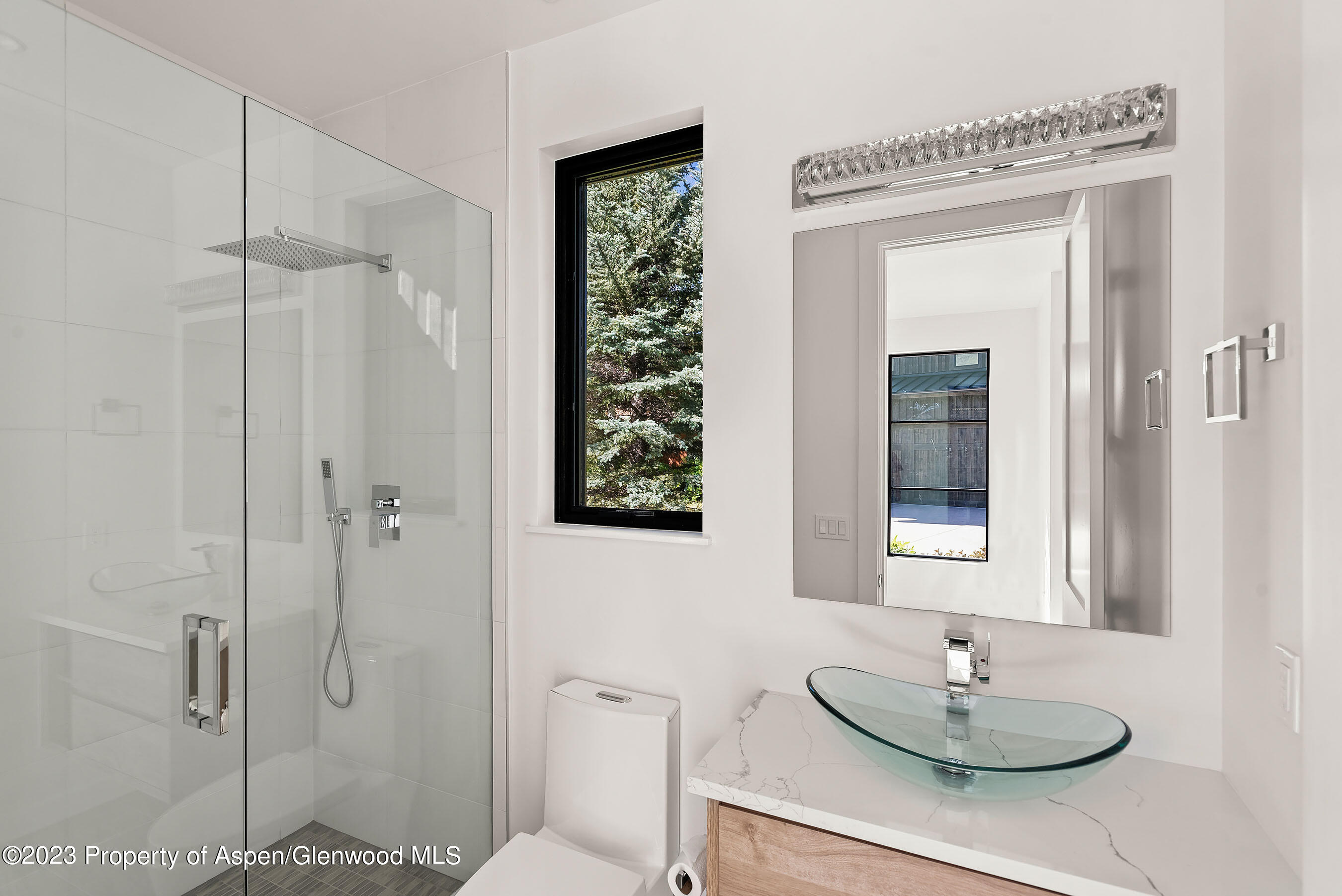 89 Fox Prowl Lane Carbondale, CO 81623 - Photo 13 of 15 a bathroom with a shower a mirror and a sink