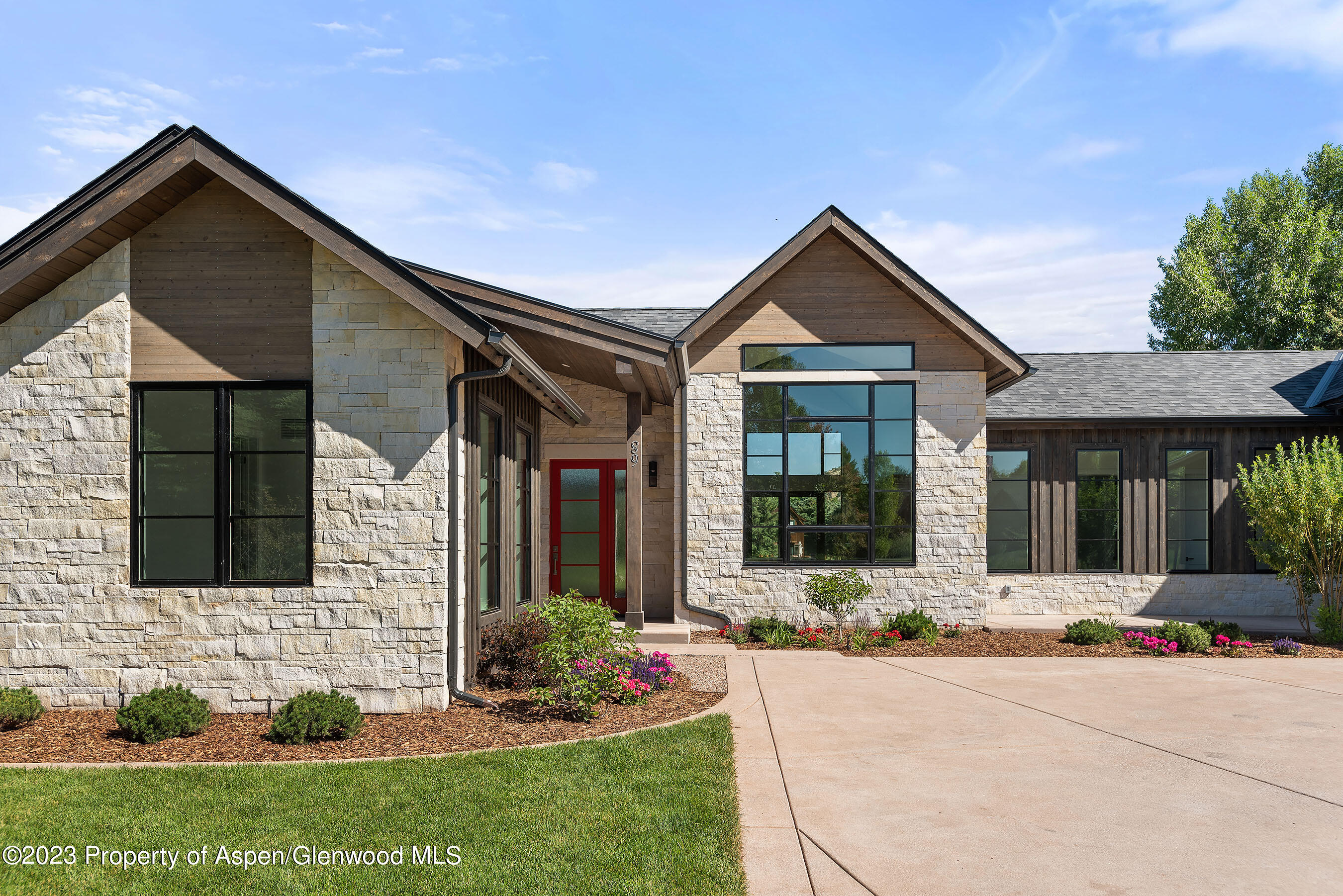 89 Fox Prowl Lane Carbondale, CO 81623 - Photo 2 of 15 a front view of a house with garden