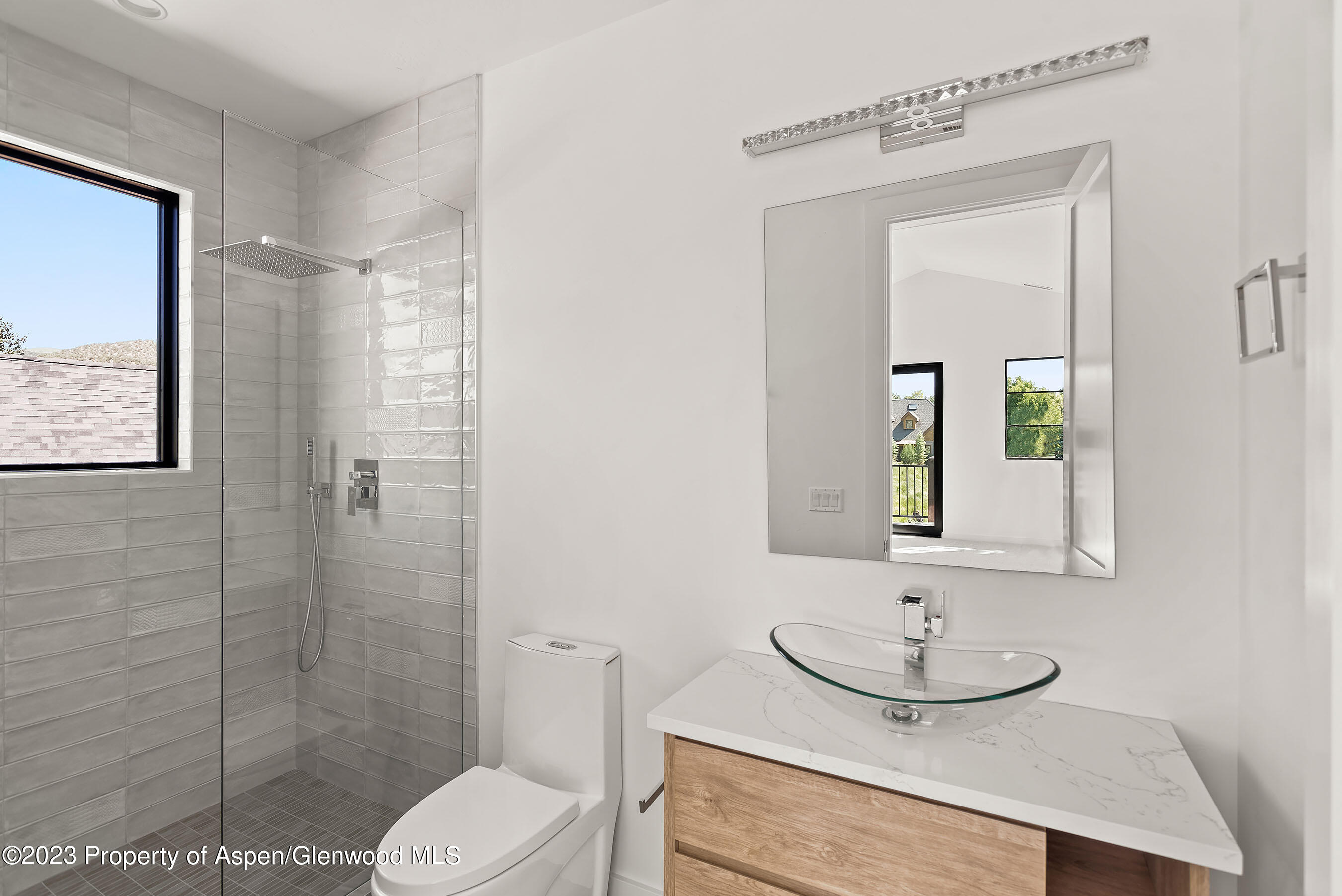 89 Fox Prowl Lane Carbondale, CO 81623 - Photo 9 of 15 a bathroom with a toilet a sink and mirror