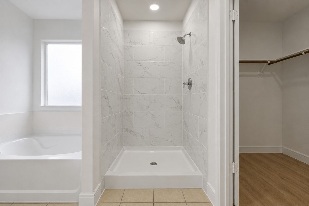 23311 Leafstone Lane Spring, TX 77373 - Photo 18 of 35 Modern shower with elegant tilework.