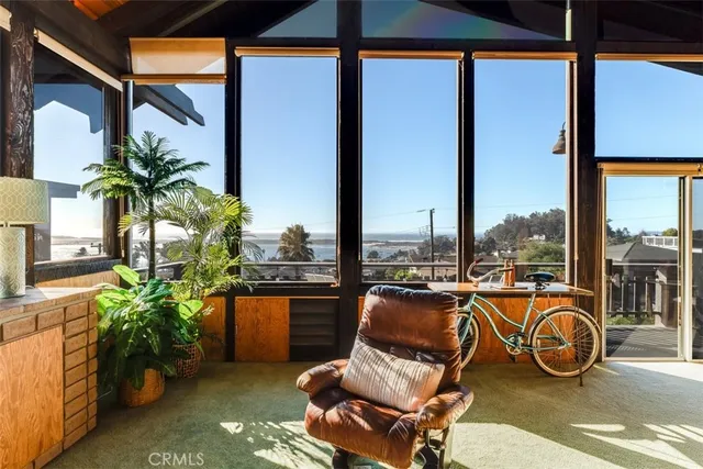 a living room with fireplace furniture and a flat screen tv