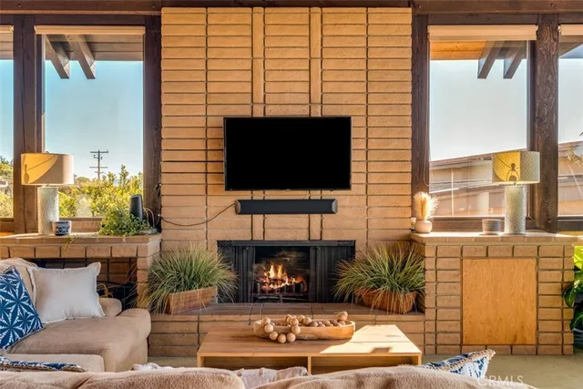 a kitchen with stainless steel appliances a stove a cabinets and wooden floor