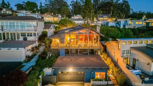 an aerial view of a house with a swimming pool