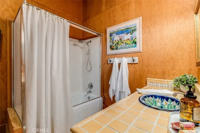 a bathroom with sink and mirror