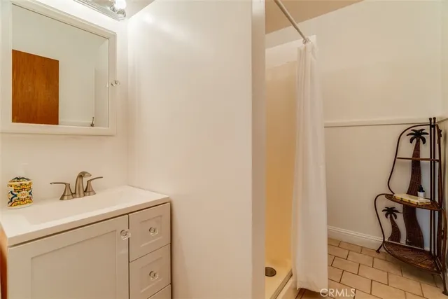 a view of a house with a small yard and plants