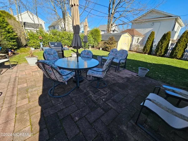 a view of a chairs and table in the patio
