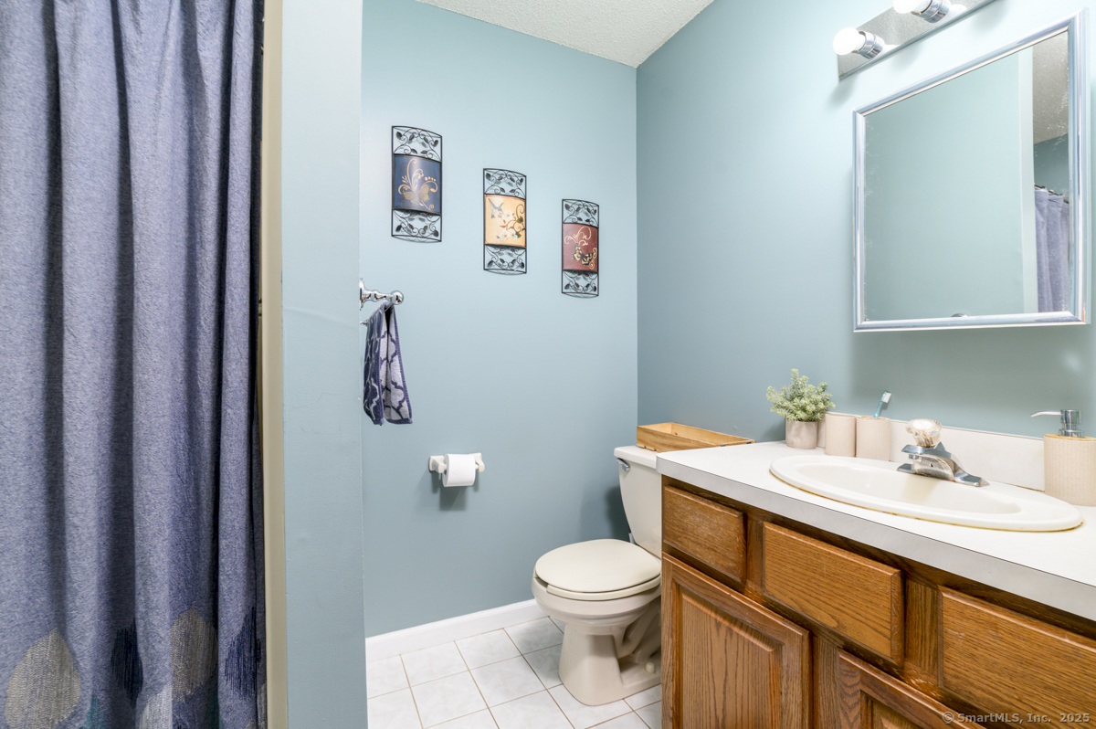 10 Hoinski Way Ansonia, CT 06401 - Photo 11 of 30 a bathroom with a sink a toilet and a mirror