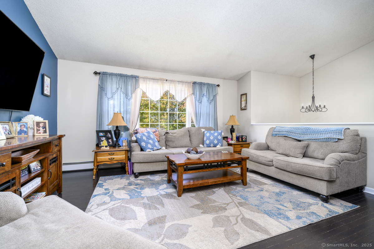 10 Hoinski Way Ansonia, CT 06401 - Photo 18 of 30 a living room with furniture and a flat screen tv