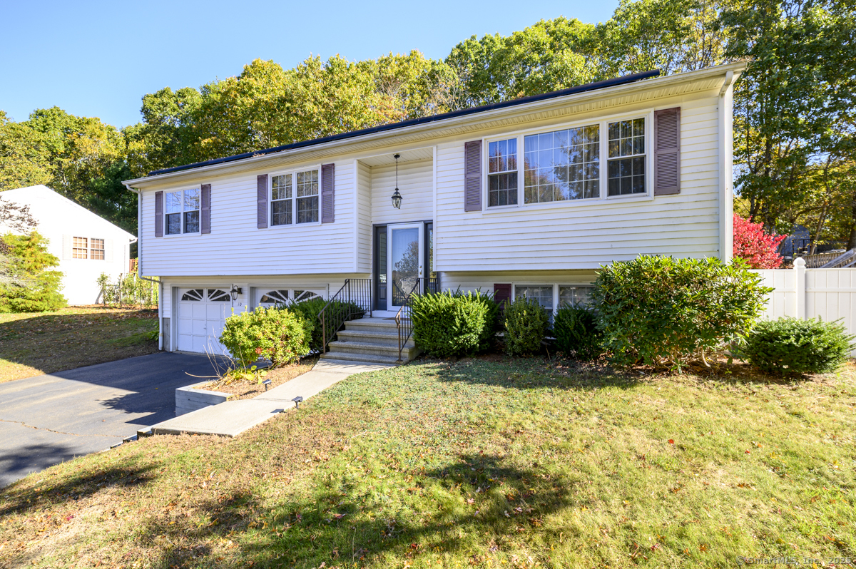 10 Hoinski Way Ansonia, CT 06401 - Photo 2 of 30 a front view of a house with a yard and potted plants