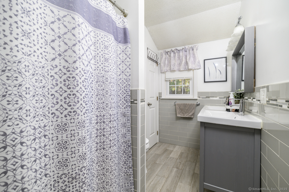 10 Hoinski Way Ansonia, CT 06401 - Photo 21 of 30 a en suite bathroom with a sink a toilet and shower