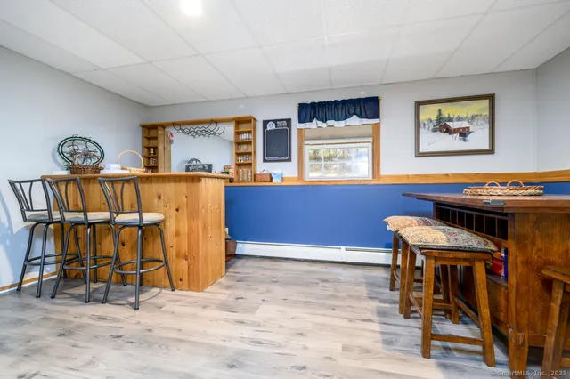 a view of a dining room with furniture and window