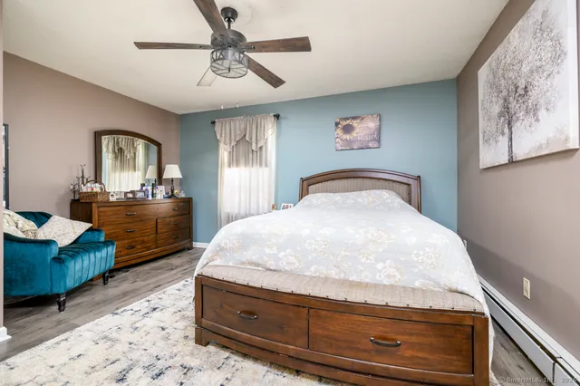 a bedroom with a bed and dresser