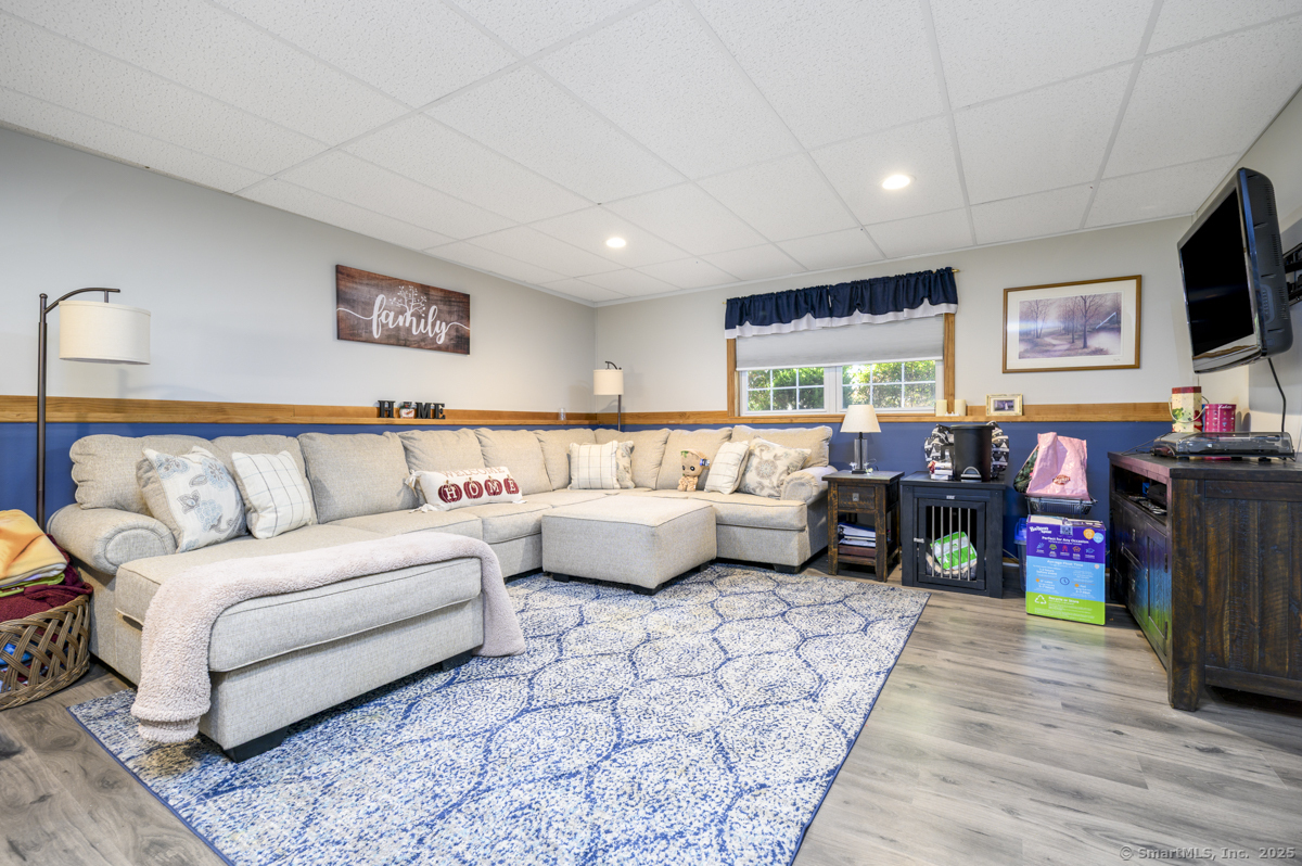 10 Hoinski Way Ansonia, CT 06401 - Photo 10 of 30 a living room with furniture and a flat screen tv