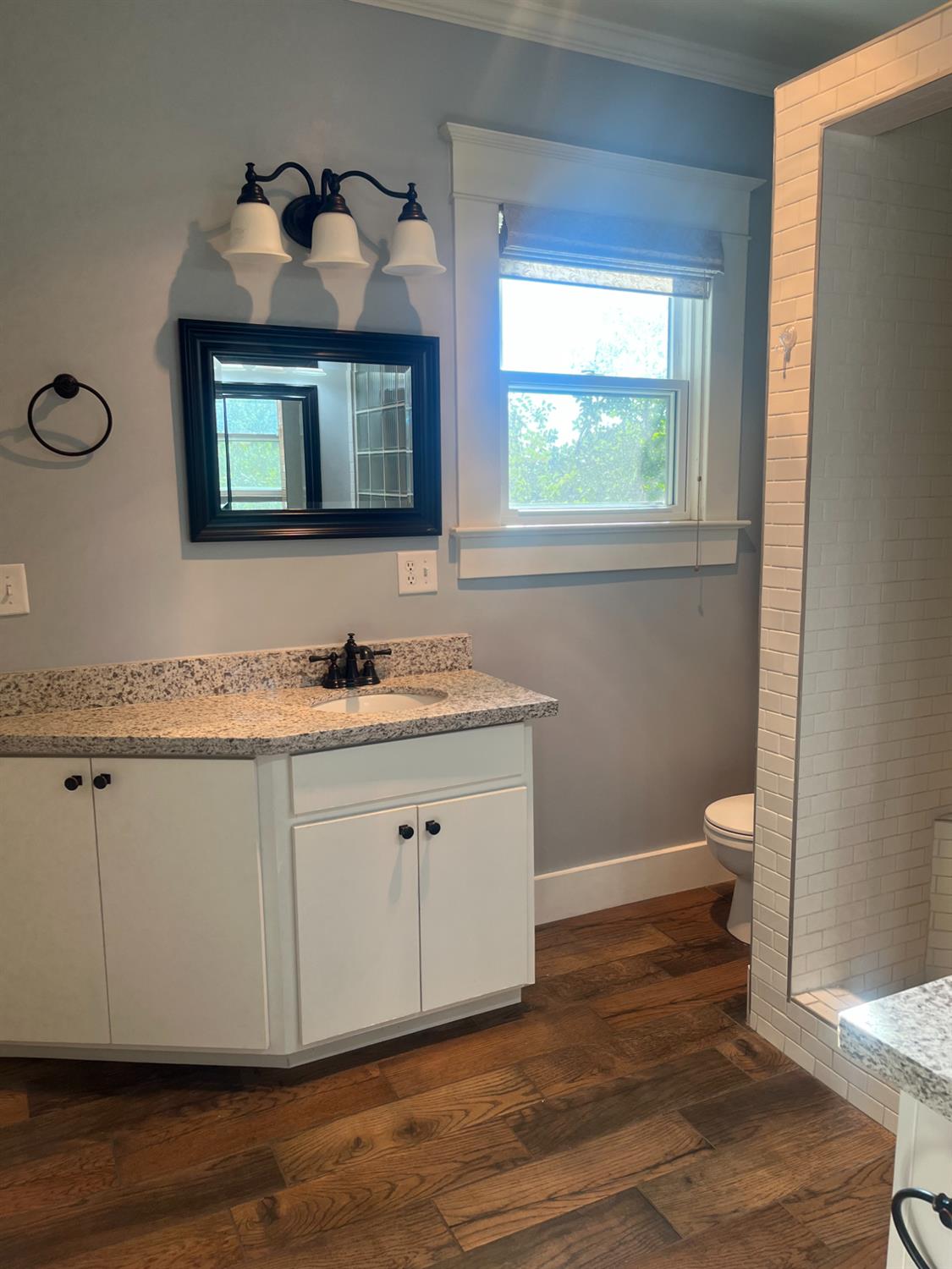 471 South Reed Avenue Reedley, CA 93654 - Photo 11 of 54 a bathroom with a granite countertop sink and a mirror