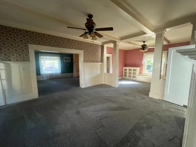a kitchen with stainless steel appliances granite countertop a lot of counter space and wooden floors
