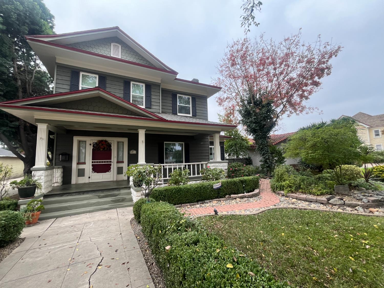 471 South Reed Avenue Reedley, CA 93654 - Photo 3 of 54 a front view of a house with a yard table and chairs