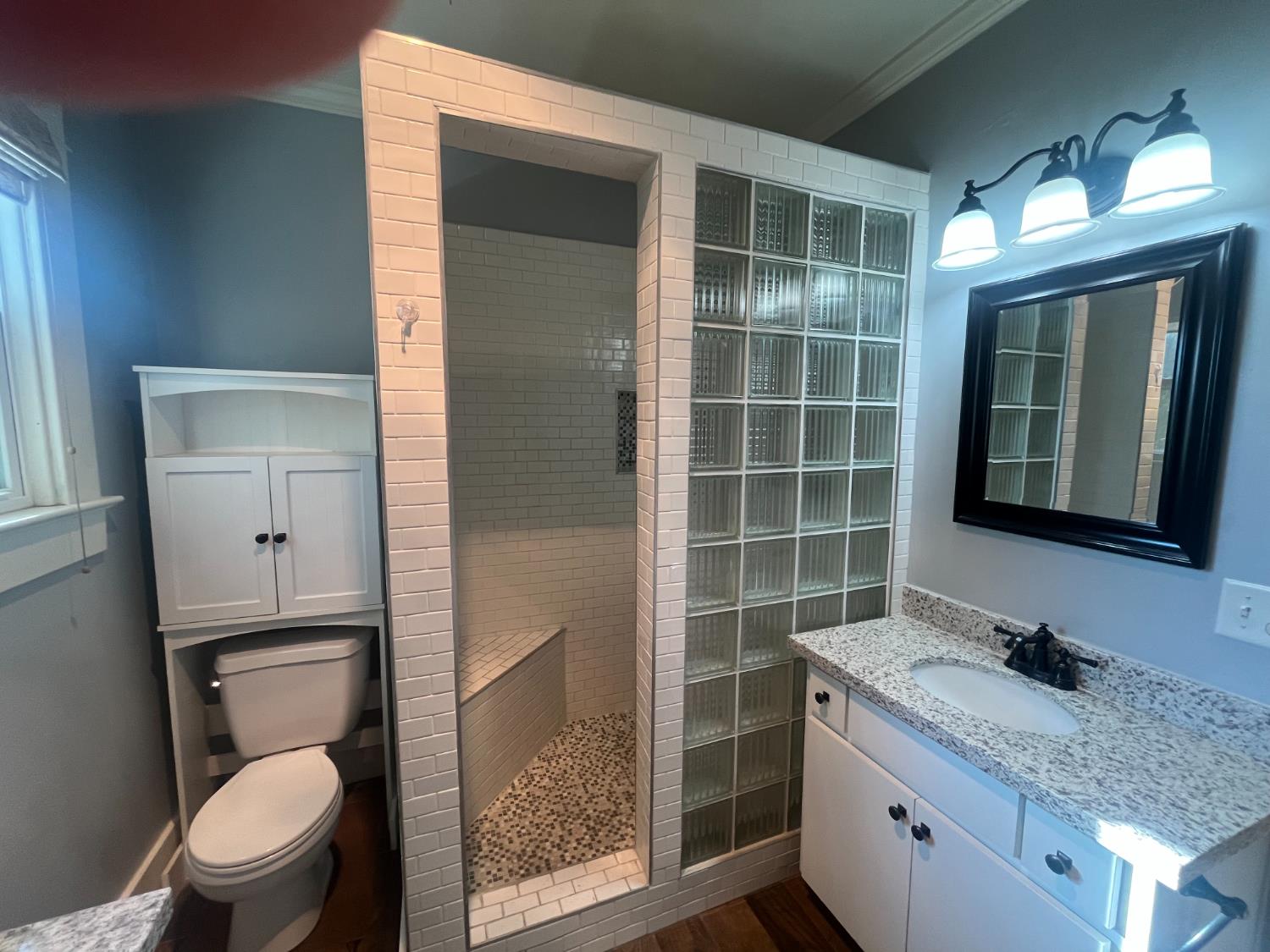 471 South Reed Avenue Reedley, CA 93654 - Photo 49 of 54 a bathroom with a granite countertop sink toilet and shower