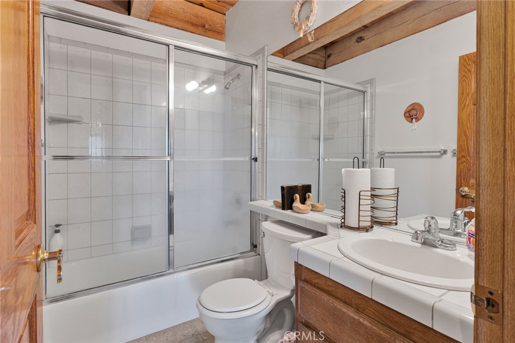 10328 El Centro Road Oak Hills, CA 92344 - Photo 19 of 43 a bathroom with a sink a toilet and shower