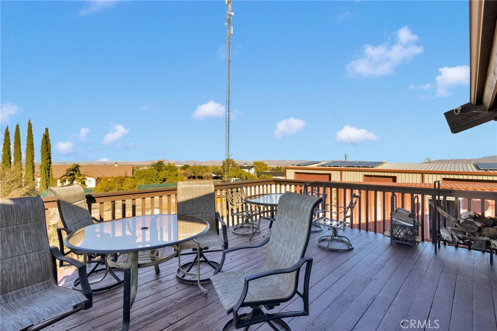 10328 El Centro Road Oak Hills, CA 92344 - Photo 29 of 43 a view of a chairs and table in swimming pool