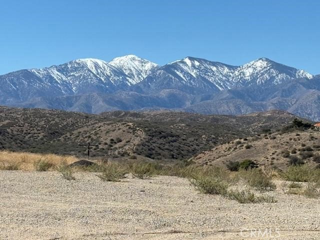 10328 El Centro Road Oak Hills, CA 92344 - Photo 41 of 43 a view of a wooden house with a mountain
