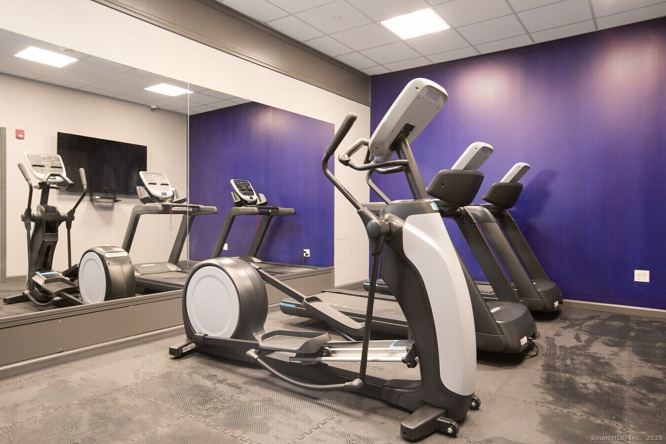 225 Lordship Boulevard, Unit 1F Stratford, CT 06615 - Photo 14 of 19 a room with gym equipment