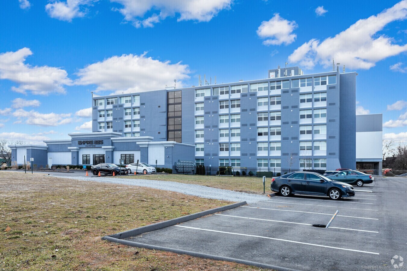 225 Lordship Boulevard, Unit 1F Stratford, CT 06615 - Photo 17 of 19 a view of a buildings and cars park