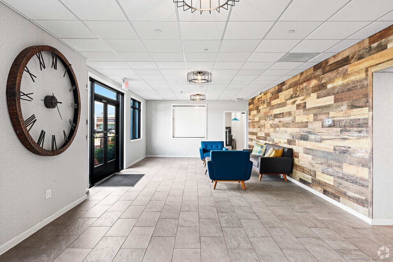 225 Lordship Boulevard, Unit 1F Stratford, CT 06615 - Photo 2 of 19 a view of livingroom with furniture and window