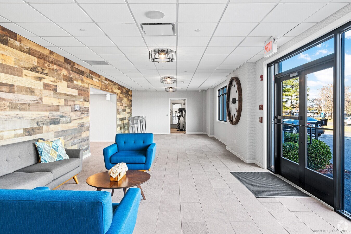 225 Lordship Boulevard, Unit 1F Stratford, CT 06615 - Photo 3 of 19 a living room with furniture and wooden floor