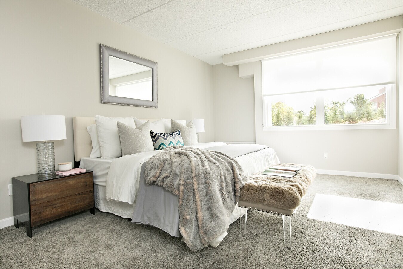 225 Lordship Boulevard, Unit 1F Stratford, CT 06615 - Photo 5 of 19 a bedroom with a bed and a window