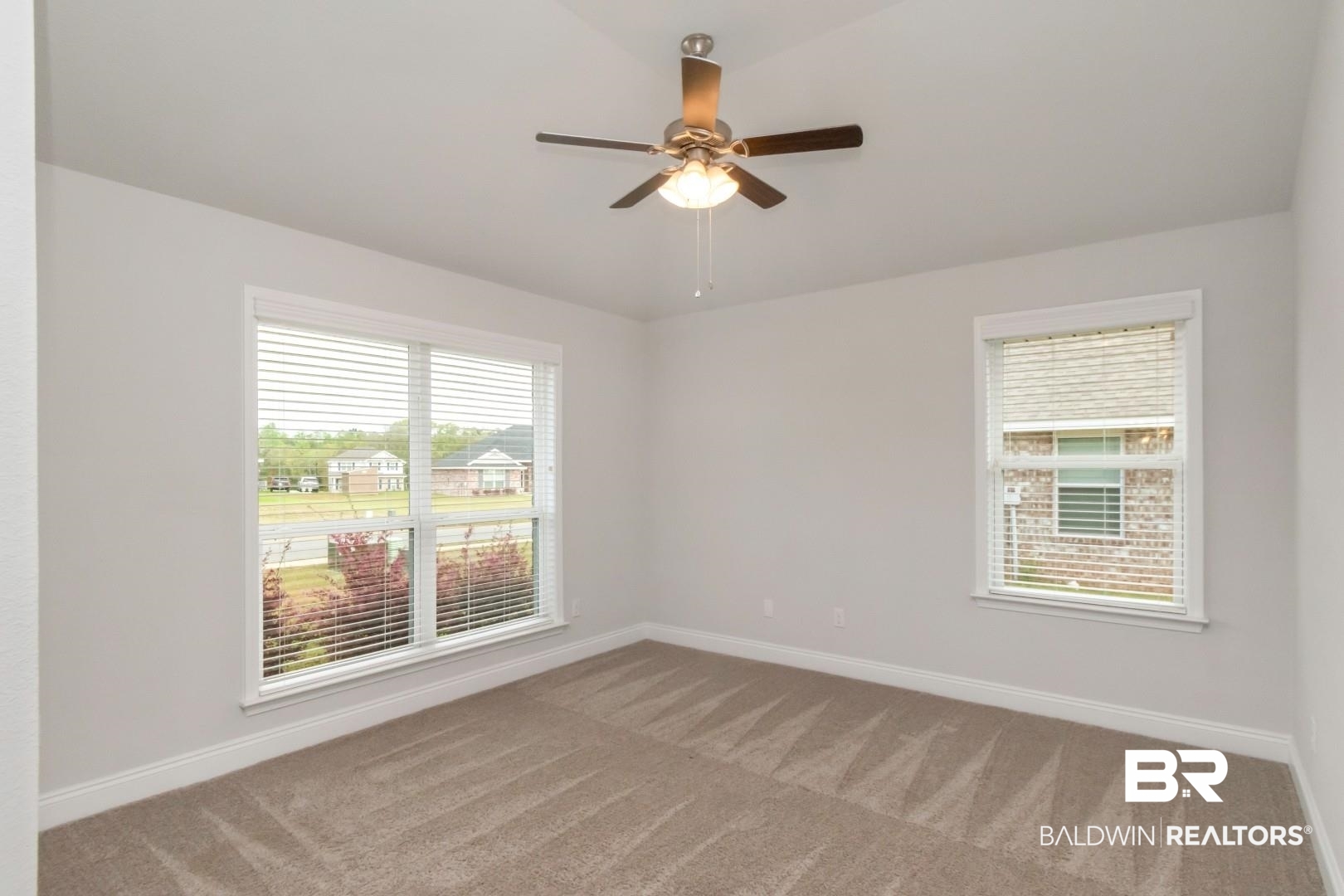 6632 Monarch Circle Mobile, AL 36618 - Photo 15 of 32 Spare room featuring light carpet and a ceiling fan