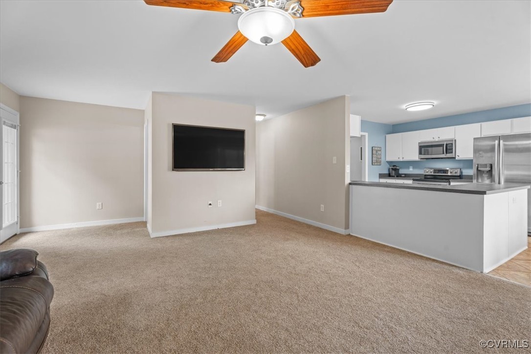 3420 Ceasar Town Road Powhatan, VA 23139 - Photo 16 of 50 Living room with light carpet and ceiling fan