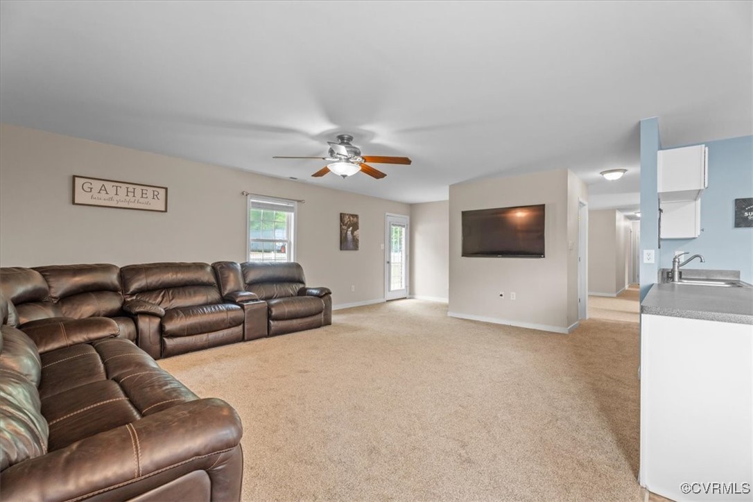 3420 Ceasar Town Road Powhatan, VA 23139 - Photo 20 of 50 Living room featuring sink, light carpet, and ceil