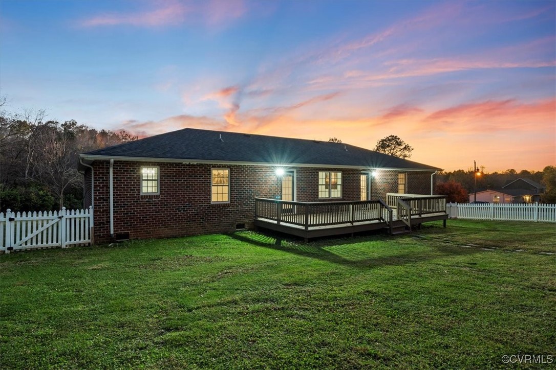 3420 Ceasar Town Road Powhatan, VA 23139 - Photo 47 of 50 Back house at dusk with a lawn and a wooden deck