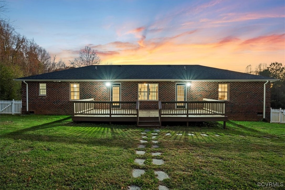 3420 Ceasar Town Road Powhatan, VA 23139 - Photo 6 of 50 Back house at dusk featuring a lawn and a wooden d