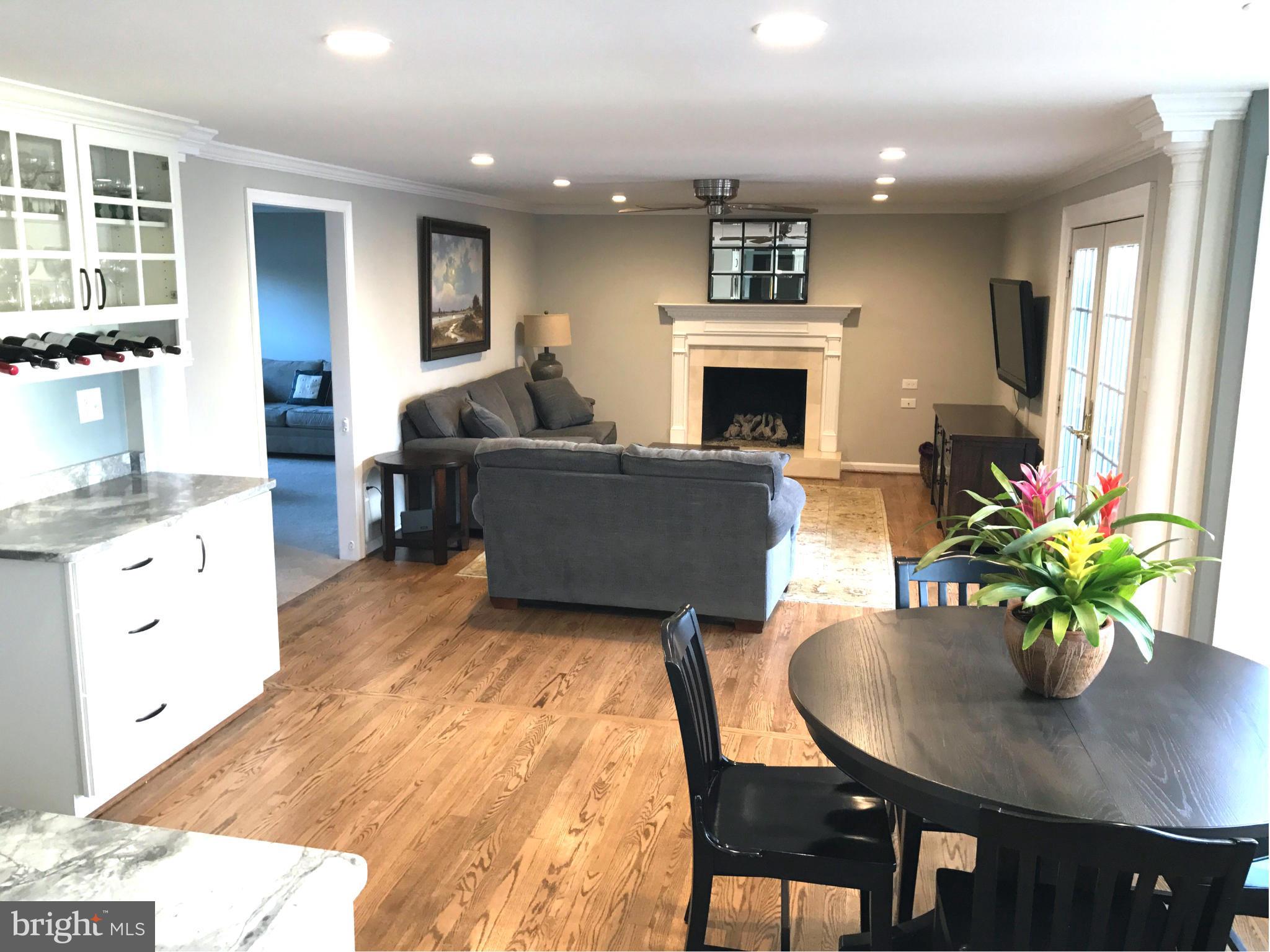 3112 Newcastle Lane Riva, MD 21140 - Photo 2 of 27 a living room with furniture a fireplace and a potted plant